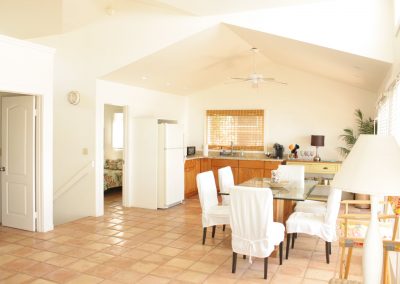 Kitchen and dining table on second floor of Kaleakai vacation house