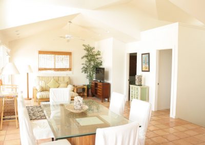 Living room and dining table on second floor of Kaleakai vacation house