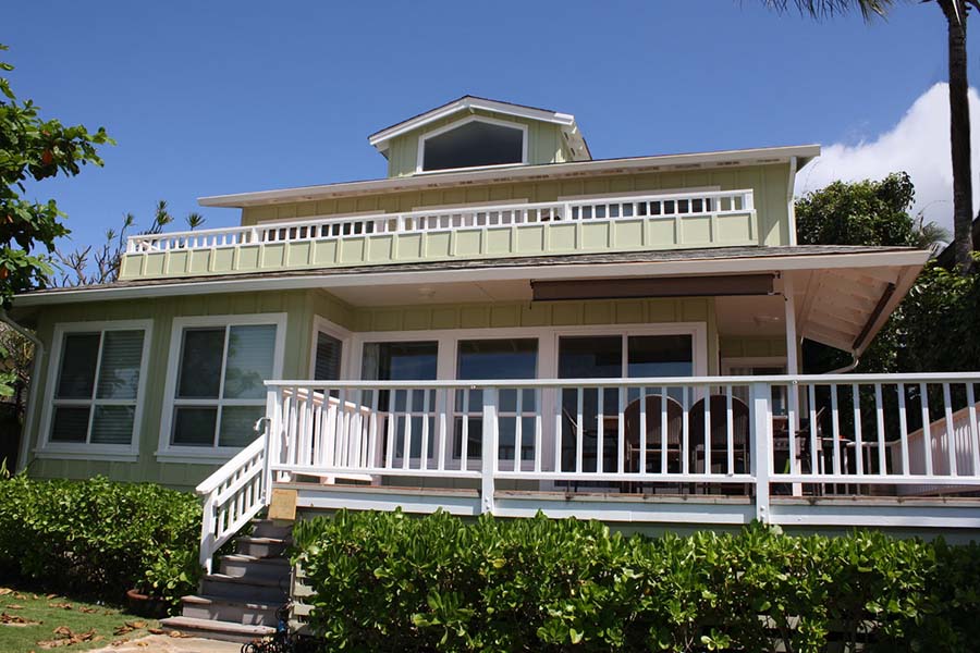 Back side of yellow beach house