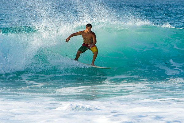 Surfer riding wave on North Shore